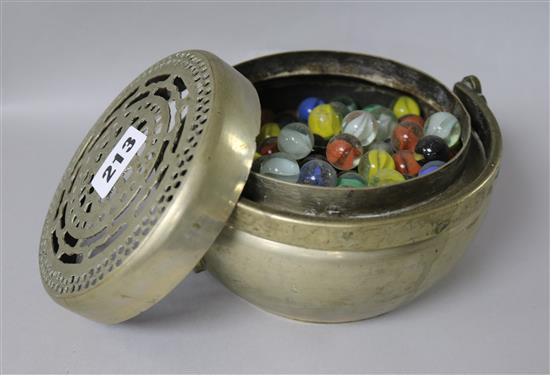 A quantity of marbles in a pot pourri bowl